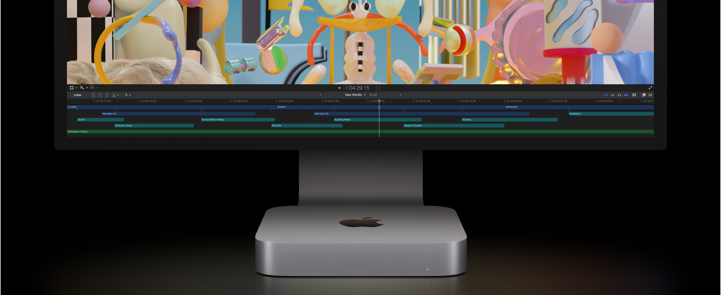 Vue de face d’un Mac mini et d’un Studio Display affichant un projet de montage vidéo dans Final Cut Pro.