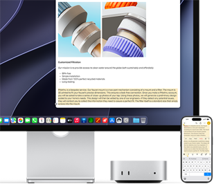 Mac mini de face, glissé sous un Studio Display, un iPhone se trouve à droite de l’appareil et de l’écran, du texte sélectionné avec les commandes Couper, Copier, Coller et Remplissage automatique en haut de l’iPhone correspond au texte surligné à l’écran, illustrant le fonctionnement du presse-papiers universel